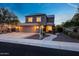 Charming two-story home featuring a three-car garage, well-manicured landscaping, and a welcoming entrance at 7230 W Pershing Ave, Peoria, AZ 85381