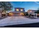 Attractive home showcasing a three-car garage, spacious driveway, manicured front yard, and inviting curb appeal at 7230 W Pershing Ave, Peoria, AZ 85381