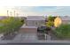 Beautiful home with a three-car garage, long driveway, well-manicured landscaping, and inviting curb appeal at 7230 W Pershing Ave, Peoria, AZ 85381