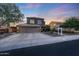 Traditional two-story home with a spacious driveway, a three car garage, and manicured landscaping at 7230 W Pershing Ave, Peoria, AZ 85381