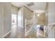 Bright hallway with wood floors, white railings, and views of the stairs and bedrooms at 7230 W Pershing Ave, Peoria, AZ 85381
