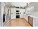 Bright kitchen with stainless steel appliances, white cabinets, and tile backsplash at 7230 W Pershing Ave, Peoria, AZ 85381