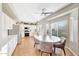 Bright eat-in kitchen features a ceiling fan and a view to the landscaped backyard at 7230 W Pershing Ave, Peoria, AZ 85381