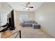 Relaxing living room includes a sectional couch and carpeted floors at 7230 W Pershing Ave, Peoria, AZ 85381