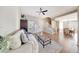 Bright living room with neutral walls, tile flooring, and a modern ceiling fan at 7230 W Pershing Ave, Peoria, AZ 85381