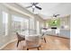 Bright open concept with dining area and living room with fireplace and entertainment center at 7230 W Pershing Ave, Peoria, AZ 85381