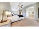 Carpeted primary bedroom with ceiling fan and views to the Primary bathroom at 7230 W Pershing Ave, Peoria, AZ 85381