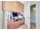 Home office features tiled floors, custom cabinets, and a bright, functional workspace at 7230 W Pershing Ave, Peoria, AZ 85381