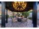 A gazebo with an inviting fire pit and seating nestled in a paved patio setting at 7230 W Pershing Ave, Peoria, AZ 85381