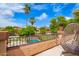 Inviting balcony featuring a comfortable hanging chair with views of the backyard and pool at 7236 W Electra Ln, Peoria, AZ 85383