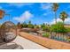 Beautiful balcony with wrought iron railings overlooking lush landscaping and a sparkling pool at 7236 W Electra Ln, Peoria, AZ 85383
