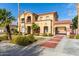 Two-story home boasting a porte-cochere, stone accents, mature palm trees, and manicured landscaping at 7236 W Electra Ln, Peoria, AZ 85383