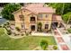 Attractive two-story home with a tile roof, manicured landscaping, and inviting entryway at 7236 W Electra Ln, Peoria, AZ 85383