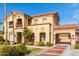 Exterior showcasing a two-story home with stone accents, porte-cochere, and well-maintained landscaping at 7236 W Electra Ln, Peoria, AZ 85383