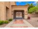 A beautiful private gated entrance with a red-bricked driveway and manicured landscaping at 7236 W Electra Ln, Peoria, AZ 85383