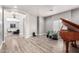 Open living room with a grand piano and neutral color scheme at 7236 W Electra Ln, Peoria, AZ 85383