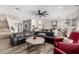 Spacious living room flows into a bright kitchen and dining area, perfect for entertaining at 7236 W Electra Ln, Peoria, AZ 85383