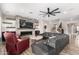 Cozy living room featuring a sleek fireplace, built-in shelving, and comfortable seating at 7236 W Electra Ln, Peoria, AZ 85383