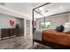 Beautiful main bedroom with a four-poster bed and fireplace; a cozy retreat at 7236 W Electra Ln, Peoria, AZ 85383