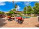 Outdoor lounge area with pool, patio, sun umbrellas, and comfortable seating at 7236 W Electra Ln, Peoria, AZ 85383