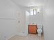 Bright bathroom featuring a walk-in shower, tiled floors, and wood vanity at 724 N Pine St, Gilbert, AZ 85233