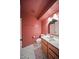 Pink bathroom featuring modern fixtures, wood vanity, and patterned flooring at 724 N Pine St, Gilbert, AZ 85233