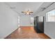 Bonus room featuring tile floors, black fridge, and ample natural light at 724 N Pine St, Gilbert, AZ 85233