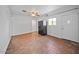 Bonus room featuring tile floors, black fridge, and an exterior door at 724 N Pine St, Gilbert, AZ 85233