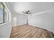 Spacious main bedroom with closet, neutral paint, and wood-look vinyl flooring at 724 N Pine St, Gilbert, AZ 85233