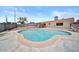 Backyard view featuring a refreshing pool with a concrete patio area, ideal for outdoor relaxation at 724 N Pine St, Gilbert, AZ 85233