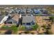 Beautiful aerial view of a modern home in a community showcasing a manicured backyard and picturesque desert surroundings at 8040 E Jaeger St, Mesa, AZ 85207