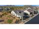 Beautiful aerial view of a modern home featuring low-maintenance landscaping, a gray tile roof and desert scenery at 8040 E Jaeger St, Mesa, AZ 85207