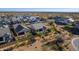 This is an aerial view of a modern, single-Gathering home with a well-manicured backyard and desert landscaping at 8040 E Jaeger St, Mesa, AZ 85207