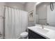 Neutral bathroom featuring a vanity with black cabinets and a shower with modern fixtures and neutral walls at 8040 E Jaeger St, Mesa, AZ 85207