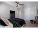 Bedroom with soft carpet, neutral walls, ceiling fan and a sliding door closet for ample storage at 8040 E Jaeger St, Mesa, AZ 85207