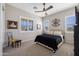Comfortable bedroom featuring plantation shutters, neutral walls, ceiling fan and soft carpet at 8040 E Jaeger St, Mesa, AZ 85207