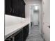 Convenient butler's pantry with countertop, cabinets, and wine fridge for entertaining at 8040 E Jaeger St, Mesa, AZ 85207