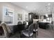 Inviting dining room with a dark wood table and views of the bright kitchen at 8040 E Jaeger St, Mesa, AZ 85207