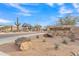 Community entrance sign with MONTE LUNA carved into the stone on a sunny day with blue skies and clouds at 8040 E Jaeger St, Mesa, AZ 85207