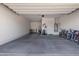 Spacious and well-lit two car garage provides ample space for parking and storage, including space for bikes at 8040 E Jaeger St, Mesa, AZ 85207