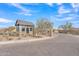 Desert community with a gate house entry and desert landscaping on a sunny day with blue skies and clouds at 8040 E Jaeger St, Mesa, AZ 85207