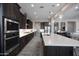 Well-equipped kitchen showcasing sleek appliances, dark cabinets, and a spacious layout at 8040 E Jaeger St, Mesa, AZ 85207
