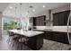 Stylish kitchen featuring a large island, pendant lighting, and stainless steel appliances at 8040 E Jaeger St, Mesa, AZ 85207