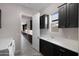 Bright laundry room boasts sleek cabinetry, a convenient sink, and leads into additional rooms at 8040 E Jaeger St, Mesa, AZ 85207