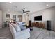 Spacious living area with a comfortable sofa, stylish decor, and tile floors providing a cozy atmosphere at 8040 E Jaeger St, Mesa, AZ 85207
