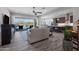 Spacious open-concept living area with modern furniture, tiled floors and access to the outdoor living space at 8040 E Jaeger St, Mesa, AZ 85207