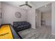 Cozy game room with a shuffleboard table, comfortable seating, and stylish decor at 8040 E Jaeger St, Mesa, AZ 85207