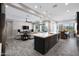 Spacious open-concept living space with a seamless flow between the kitchen and living room at 8040 E Jaeger St, Mesa, AZ 85207