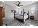 Comfortable main bedroom featuring four-poster bed, calm wall art and neutral décor at 8040 E Jaeger St, Mesa, AZ 85207