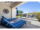 Inviting outdoor patio with comfortable lounge chairs and views of the professionally landscaped backyard at 8040 E Jaeger St, Mesa, AZ 85207